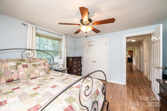 559 15th Ave SE, Hickory, NC 28602 - bedroom with wood finished floors, a closet, and ceiling fan
