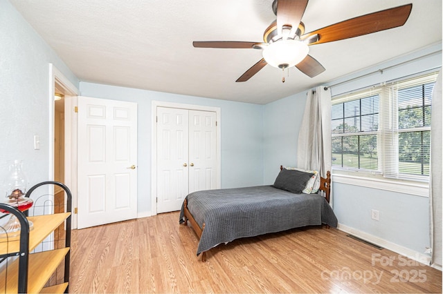 559 15th Ave SE, Hickory, NC 28602 - bedroom featuring light wood-style floors, a closet, and ceiling fan