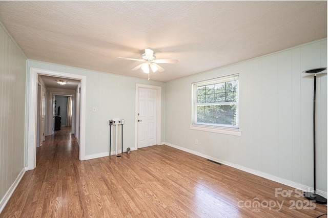 559 15th Ave SE, Hickory, NC 28602 - empty room featuring wood finished floors, ceiling fan, and a textured ceiling