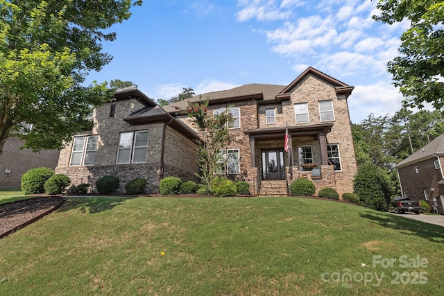 16522 Flintrock Falls Ln, Charlotte, NC 28278 - view of front facade featuring a front lawn, brick siding, and a porch