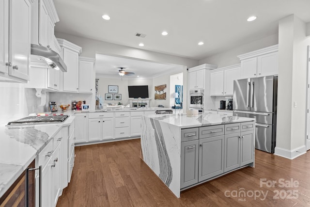 16522 Flintrock Falls Ln, Charlotte, NC 28278 - kitchen with stainless steel appliances, a center island, white cabinetry, dark wood-style flooring, and recessed lighting