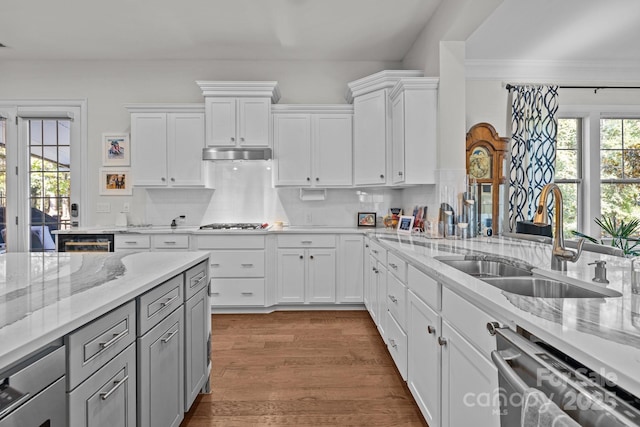 16522 Flintrock Falls Ln, Charlotte, NC 28278 - kitchen featuring stainless steel appliances, backsplash, light stone counters, gray cabinetry, and white cabinets