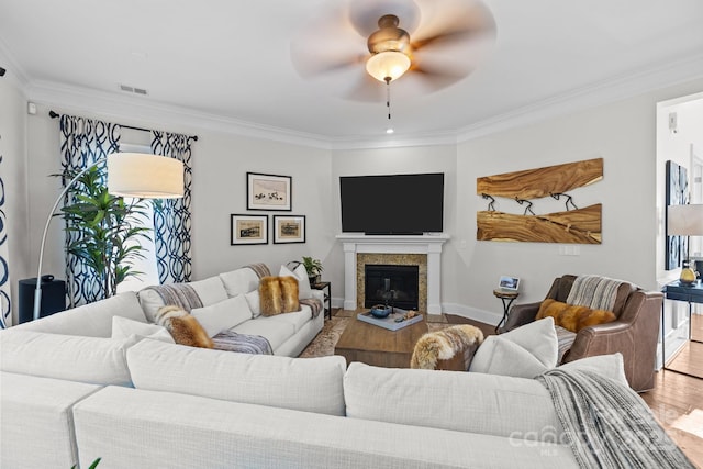 16522 Flintrock Falls Ln, Charlotte, NC 28278 - living room featuring wood finished floors, crown molding, a ceiling fan, and a fireplace