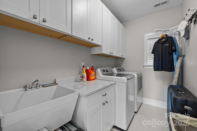 16522 Flintrock Falls Ln, Charlotte, NC 28278 - washroom featuring light marble finish flooring, cabinet space, and washing machine and dryer