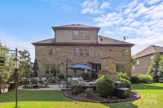 16522 Flintrock Falls Ln, Charlotte, NC 28278 - back of house with a patio, a lawn, brick siding, and outdoor lounge area