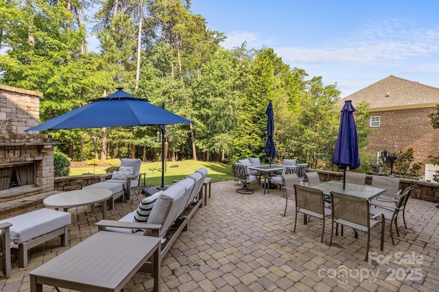16522 Flintrock Falls Ln, Charlotte, NC 28278 - view of patio with outdoor dining space and an outdoor living space with a fireplace