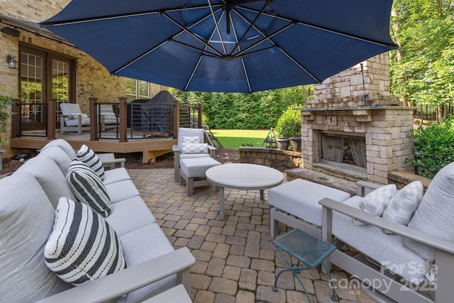 16522 Flintrock Falls Ln, Charlotte, NC 28278 - view of patio / terrace with an outdoor living space with a fireplace