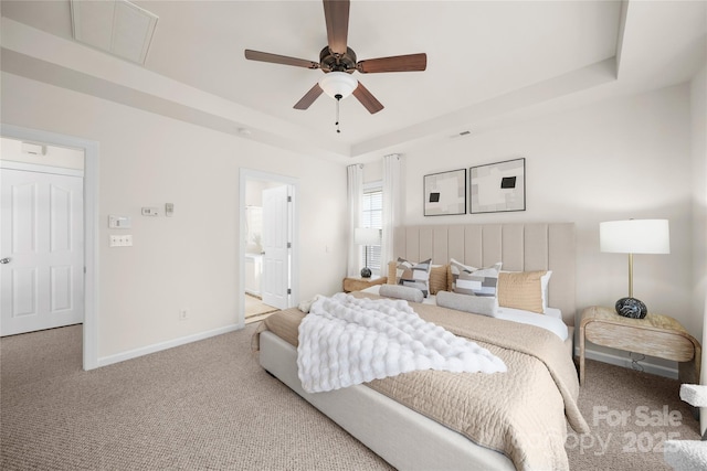 14801 Provence Ln, Charlotte, NC 28277 - bedroom with a raised ceiling, carpet flooring, ensuite bath, and ceiling fan