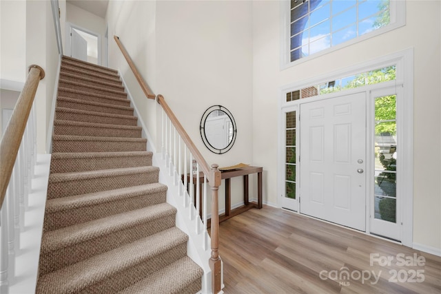 14801 Provence Ln, Charlotte, NC 28277 - foyer with stairs, light wood-style floors, and a high ceiling