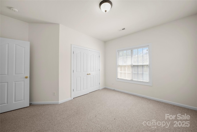 14801 Provence Ln, Charlotte, NC 28277 - unfurnished bedroom with carpet flooring and a closet
