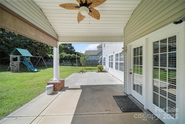 14801 Provence Ln, Charlotte, NC 28277 - fenced backyard with a patio, a ceiling fan, and a playground