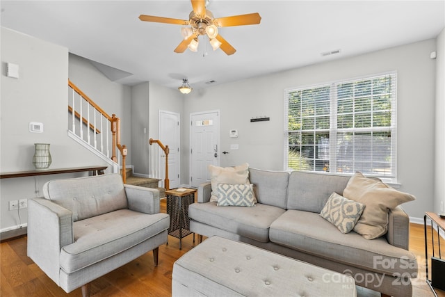 514 Bent Leaf Ct, Fort Mill, SC 29708 - living room with wood finished floors, a ceiling fan, and stairs
