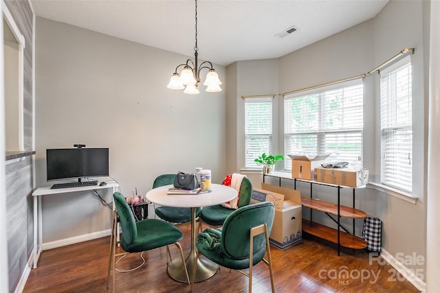 11521 Savannah Creek Dr, Charlotte, NC 28273 - dining area featuring wood finished floors and a chandelier