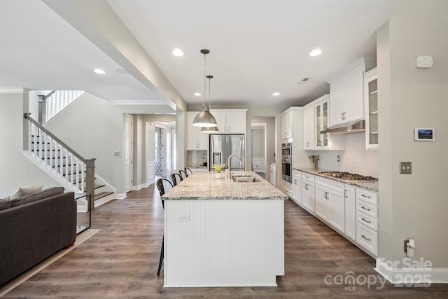 10437 Paper Birch Dr, Charlotte, NC 28215 - kitchen with stainless steel appliances, decorative backsplash, white cabinets, and recessed lighting