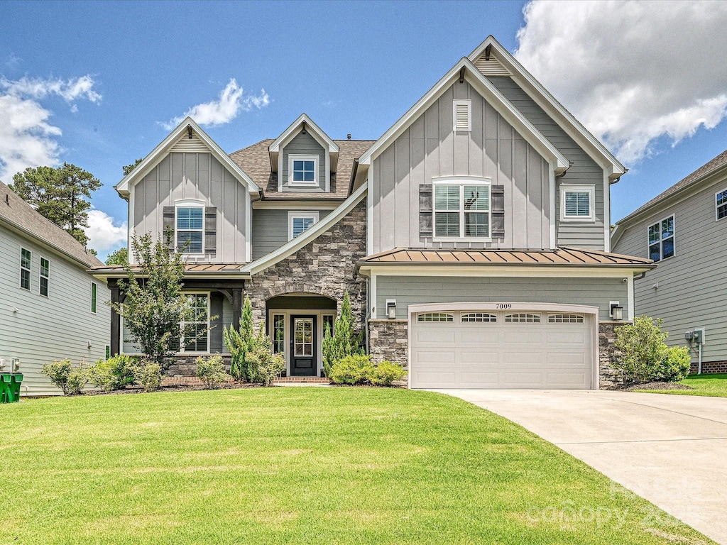 7009 Providence Ln W, Charlotte, NC 28226 - craftsman-style home with board and batten siding, a standing seam roof, driveway, and stone siding