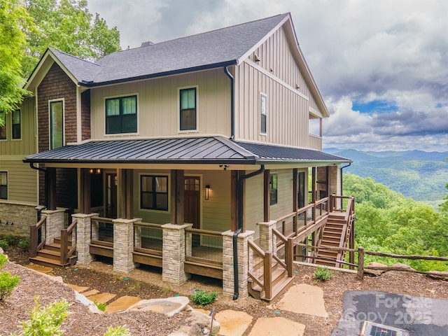 55 Steeplebush Ct Unit 629, Tuckasegee, NC 28783 - view of front of home featuring covered porch, stairway, roof with shingles, and board and batten siding