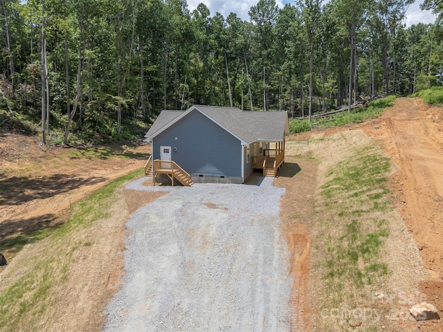 626 Felmet Rd, Flat Rock, NC 28731 - view of front facade with crawl space, driveway, and a view of trees