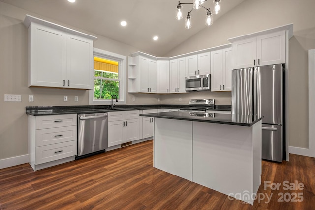 626 Felmet Rd, Flat Rock, NC 28731 - kitchen with stainless steel appliances, white cabinets, lofted ceiling, and recessed lighting