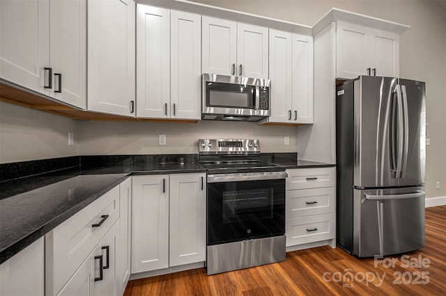 626 Felmet Rd, Flat Rock, NC 28731 - kitchen with stainless steel appliances, dark wood-style flooring, dark stone counters, and white cabinetry