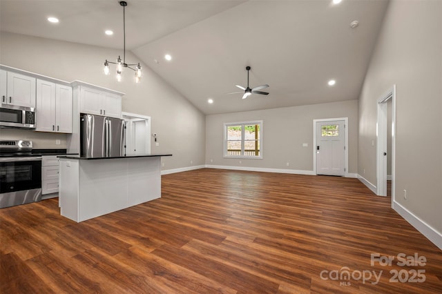 626 Felmet Rd, Flat Rock, NC 28731 - kitchen featuring stainless steel appliances, high vaulted ceiling, a ceiling fan, dark countertops, and a center island