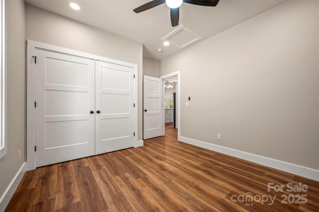 626 Felmet Rd, Flat Rock, NC 28731 - unfurnished bedroom with dark wood-style flooring, recessed lighting, a closet, ceiling fan, and attic access