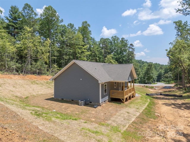 626 Felmet Rd, Flat Rock, NC 28731 - view of side of property with crawl space, a wooded view, roof with shingles, a deck, and driveway