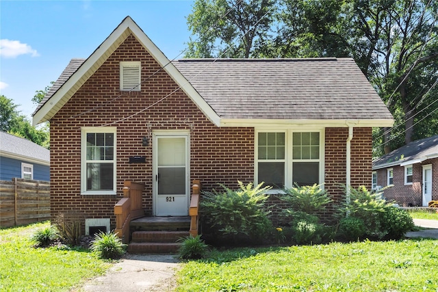 921 N Jackson St, Salisbury, NC 28144 - view of front of house featuring brick siding and a shingled roof