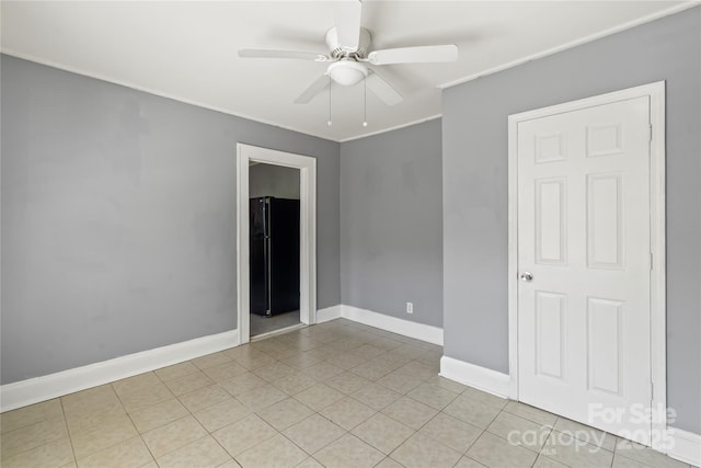 921 N Jackson St, Salisbury, NC 28144 - empty room with ceiling fan, ornamental molding, and light tile patterned floors