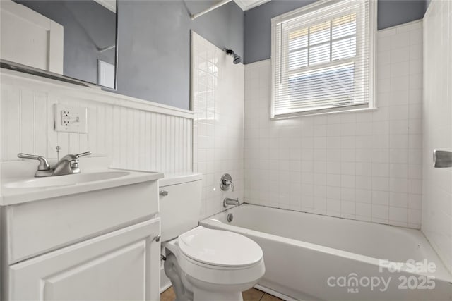 921 N Jackson St, Salisbury, NC 28144 - full bathroom with vanity, bathtub / shower combination, and wainscoting