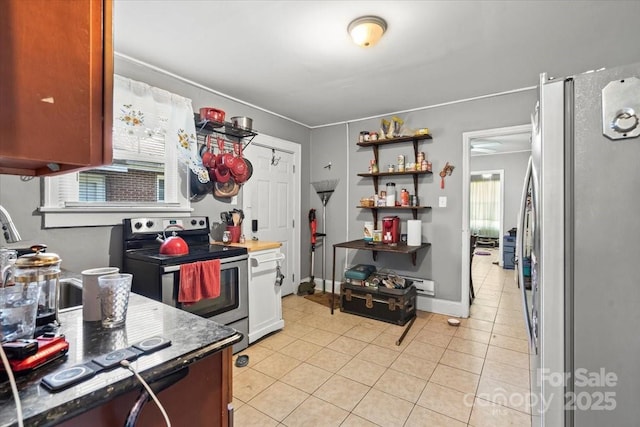 921 N Jackson St, Salisbury, NC 28144 - kitchen featuring stainless steel appliances, light tile patterned flooring, and open shelves