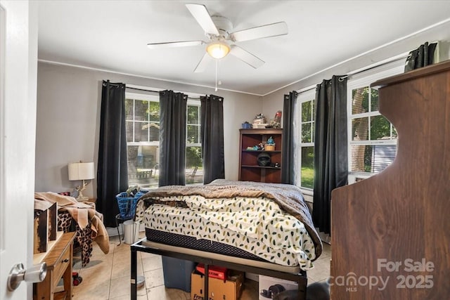 921 N Jackson St, Salisbury, NC 28144 - bedroom with light tile patterned flooring, multiple windows, and ceiling fan