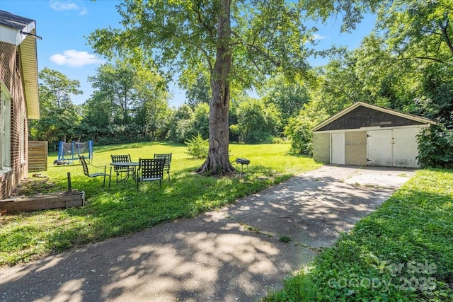 921 N Jackson St, Salisbury, NC 28144 - view of green lawn featuring a garage and an outdoor structure