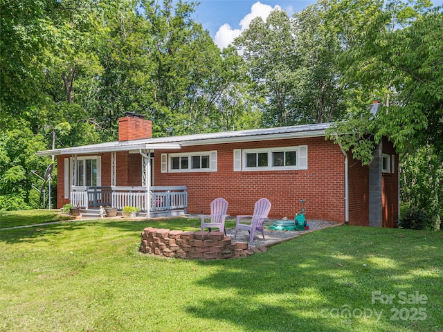 90 Hemlock Hill Hts, Canton, NC 28716 - rear view of property with a chimney, a yard, brick siding, a metal roof, and a patio