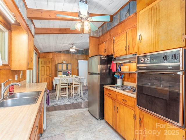 90 Hemlock Hill Hts, Canton, NC 28716 - kitchen featuring stainless steel appliances, under cabinet range hood, light countertops, ceiling fan, and brown cabinetry