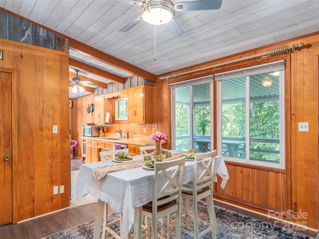 90 Hemlock Hill Hts, Canton, NC 28716 - dining space with wood walls, a ceiling fan, dark wood-style flooring, and a wooden ceiling with exposed beams