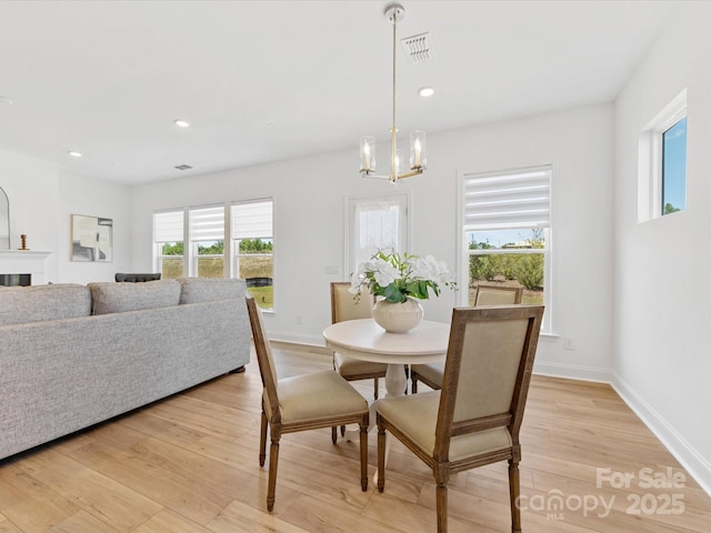 1516 Respect St NW, Concord, NC 28027 - dining space with a chandelier, light wood-type flooring, and recessed lighting