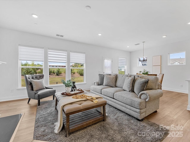 1516 Respect St NW, Concord, NC 28027 - living area featuring light wood-style flooring, plenty of natural light, a chandelier, and recessed lighting