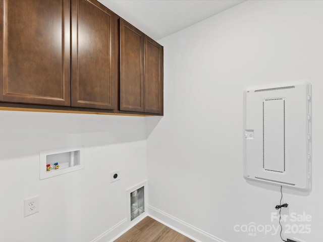 1516 Respect St NW, Concord, NC 28027 - washroom featuring cabinet space, electric dryer hookup, hookup for a washing machine, and wood finished floors