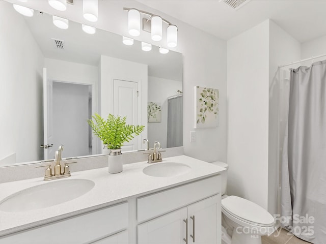 1516 Respect St NW, Concord, NC 28027 - full bathroom featuring double vanity, curtained shower, and tile patterned floors