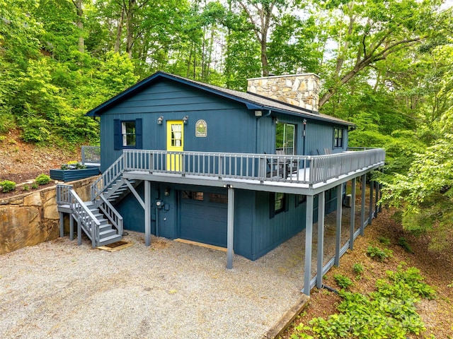 220 Deer Run Rd, Canton, NC 28716 - view of front of property featuring stairs, gravel driveway, a deck, a garage, and a chimney