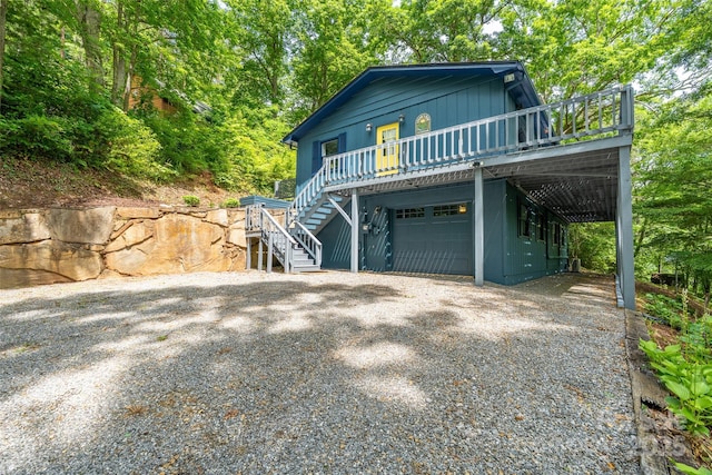 220 Deer Run Rd, Canton, NC 28716 - view of front facade with stairs, gravel driveway, a garage, and a deck