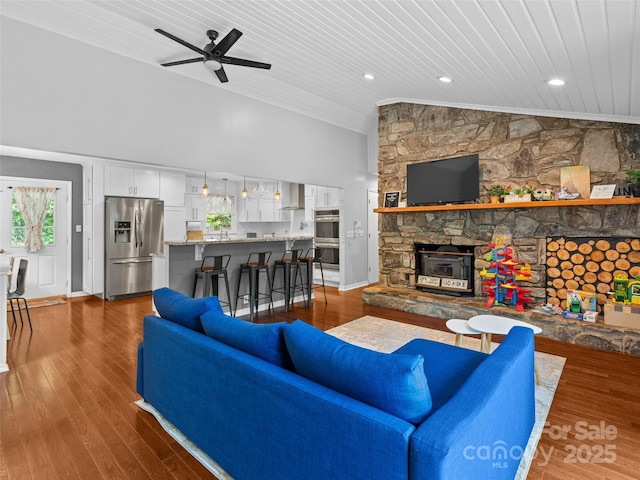 220 Deer Run Rd, Canton, NC 28716 - living area featuring vaulted ceiling, crown molding, wooden ceiling, a fireplace, and a ceiling fan
