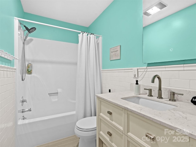 220 Deer Run Rd, Canton, NC 28716 - bathroom with tile walls, shower / bathtub combination with curtain, vanity, a wainscoted wall, and wood finished floors