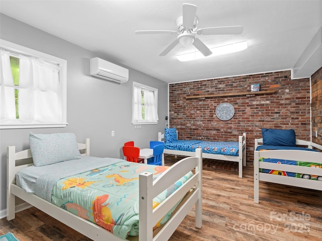 220 Deer Run Rd, Canton, NC 28716 - bedroom featuring a wall unit AC, brick wall, wood finished floors, and a ceiling fan