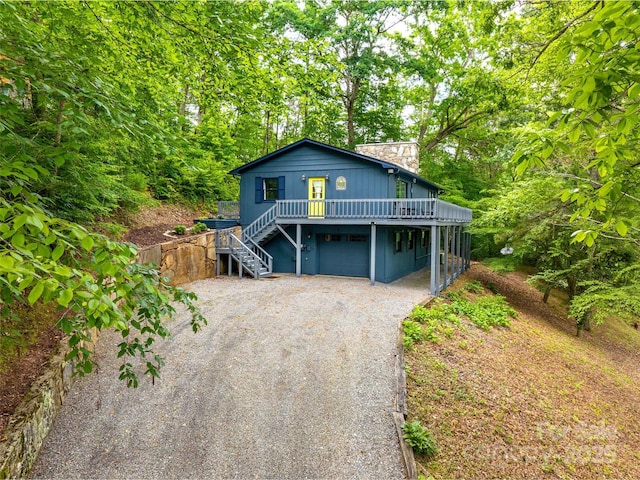 220 Deer Run Rd, Canton, NC 28716 - view of front of property with dirt driveway, stairway, a chimney, and a garage