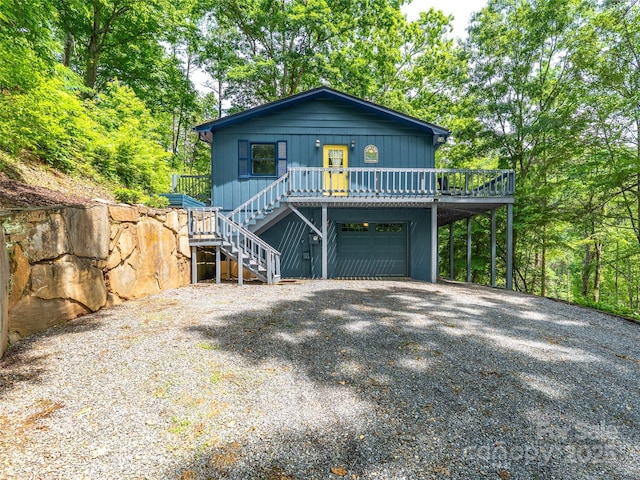 220 Deer Run Rd, Canton, NC 28716 - view of front of house featuring stairs, driveway, an attached garage, and a wooden deck