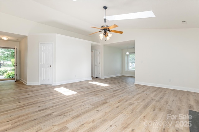 802 Woodlark Ct, Fletcher, NC 28732 - empty room with a skylight, light wood-type flooring, a ceiling fan, and vaulted ceiling