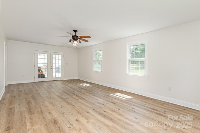 802 Woodlark Ct, Fletcher, NC 28732 - spare room with light wood-style flooring, ceiling fan, and french doors
