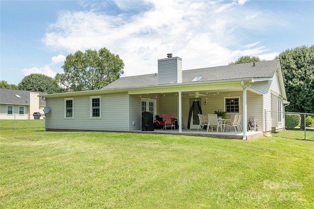 802 Woodlark Ct, Fletcher, NC 28732 - back of house featuring a ceiling fan, a patio, and a chimney