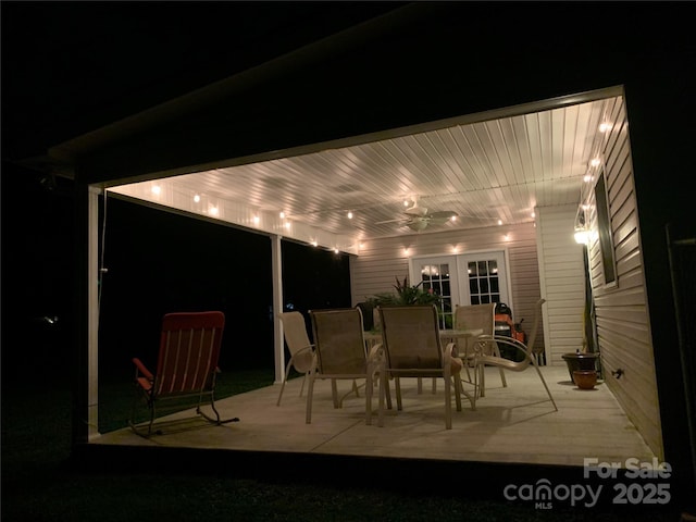 802 Woodlark Ct, Fletcher, NC 28732 - patio at night featuring ceiling fan, a patio area, and outdoor dining space